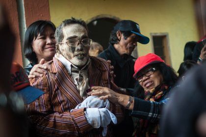 *** EDITOR'S NOTE: GRAPHIC CONTENT *** TORAJA, INDONESIA - AUGUST 26: Relatives clean the body of Paul Sampe Lumba who has been dead for seven yeas during the Ma'nene ritual at Panggala Village on August 26, 2016 in Toraja, Indonesia. The Ma'nene ritual in performed during a ceremony every three years, where the dead are exhumed for a change of clothes, among the people of Toraja as an expression of the love of the surviving family. PHOTOGRAPH BY Sijori Images / Barcroft Images London-T:+44 207 033 1031 E:hello@barcroftmedia.com - New York-T:+1 212 796 2458 E:hello@barcroftusa.com - New Delhi-T:+91 11 4053 2429 E:hello@barcroftindia.com www.barcroftimages.com